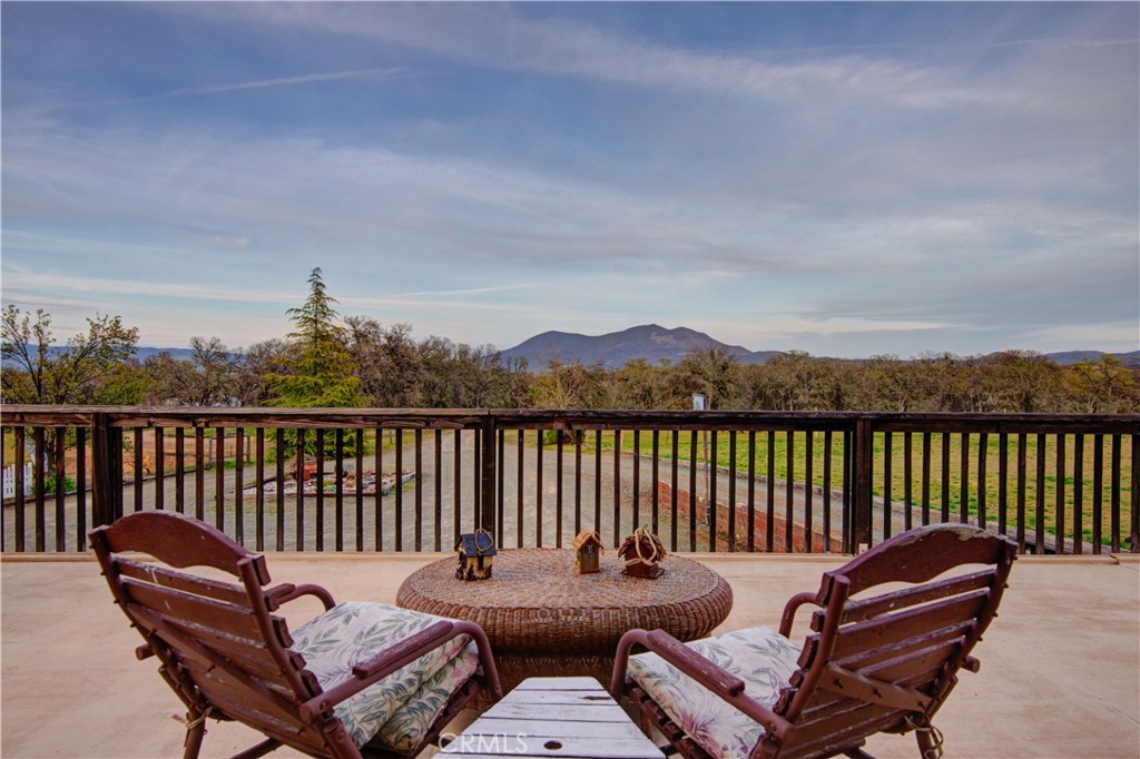 340 Fritch Road Lakeport, CA 95453 - Photo 31 of 65 a balcony with wooden floor table and chairs