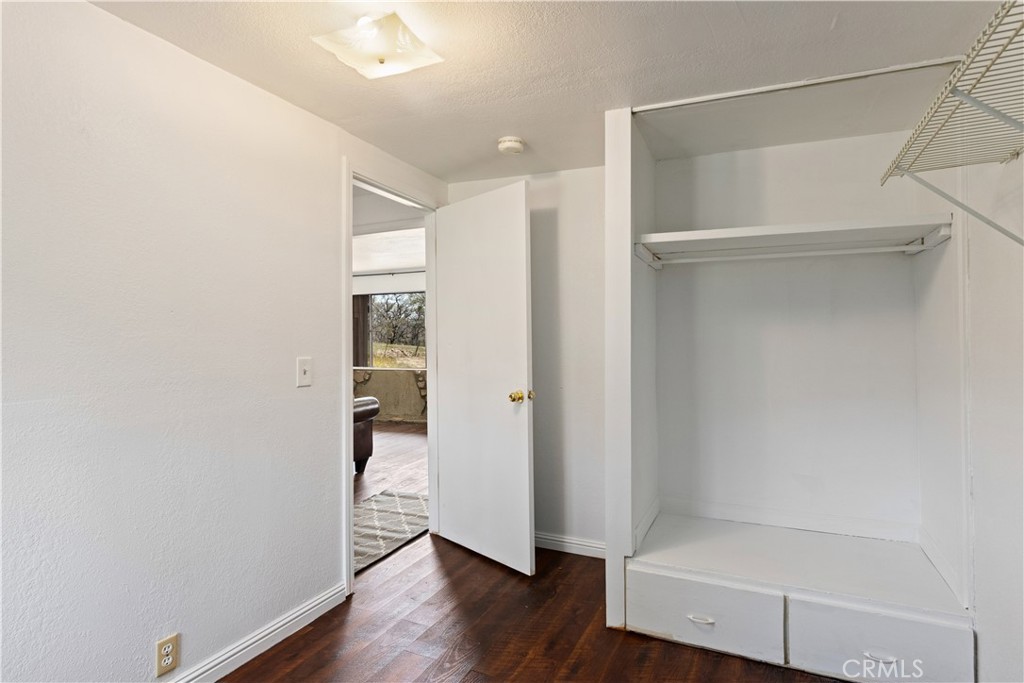 340 Fritch Road Lakeport, CA 95453 - Photo 38 of 65 a view of an empty room with wooden floor and a window