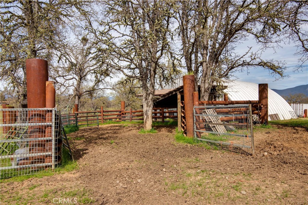 340 Fritch Road Lakeport, CA 95453 - Photo 45 of 65 front view of a house with a large tree and wooden fence