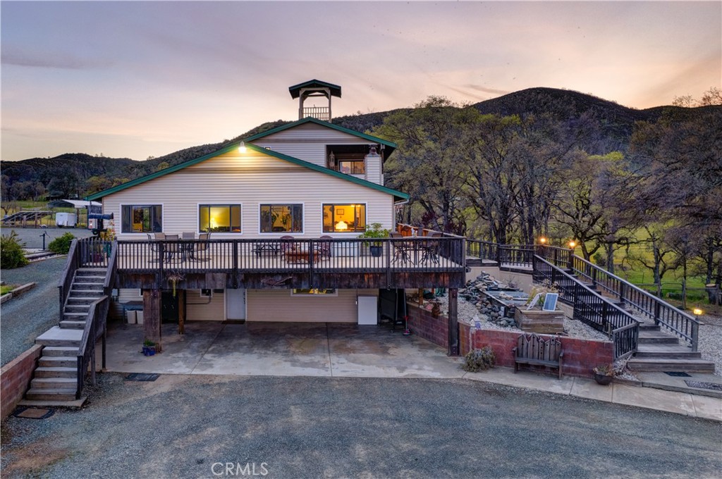 340 Fritch Road Lakeport, CA 95453 - Photo 57 of 65 a front view of a house with a yard and balcony