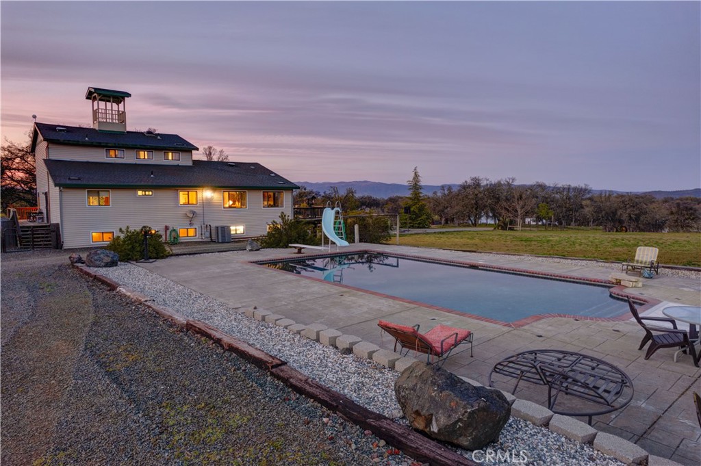 340 Fritch Road Lakeport, CA 95453 - Photo 60 of 65 a view of swimming pool with a table and chairs under an umbrella