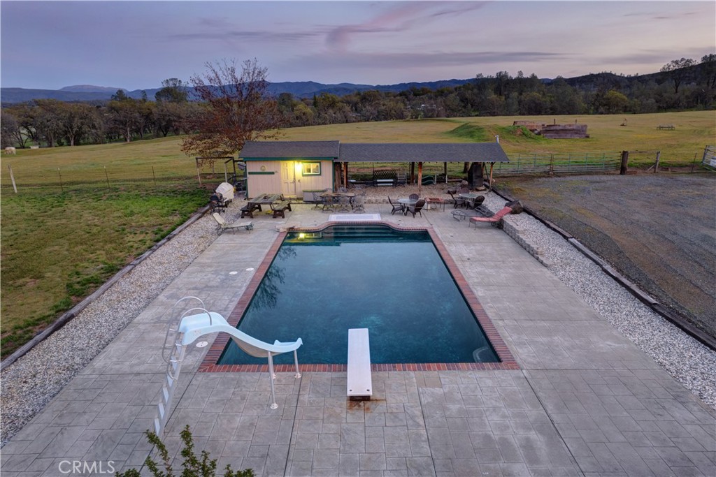 340 Fritch Road Lakeport, CA 95453 - Photo 62 of 65 a view of a lake with a table and chairs