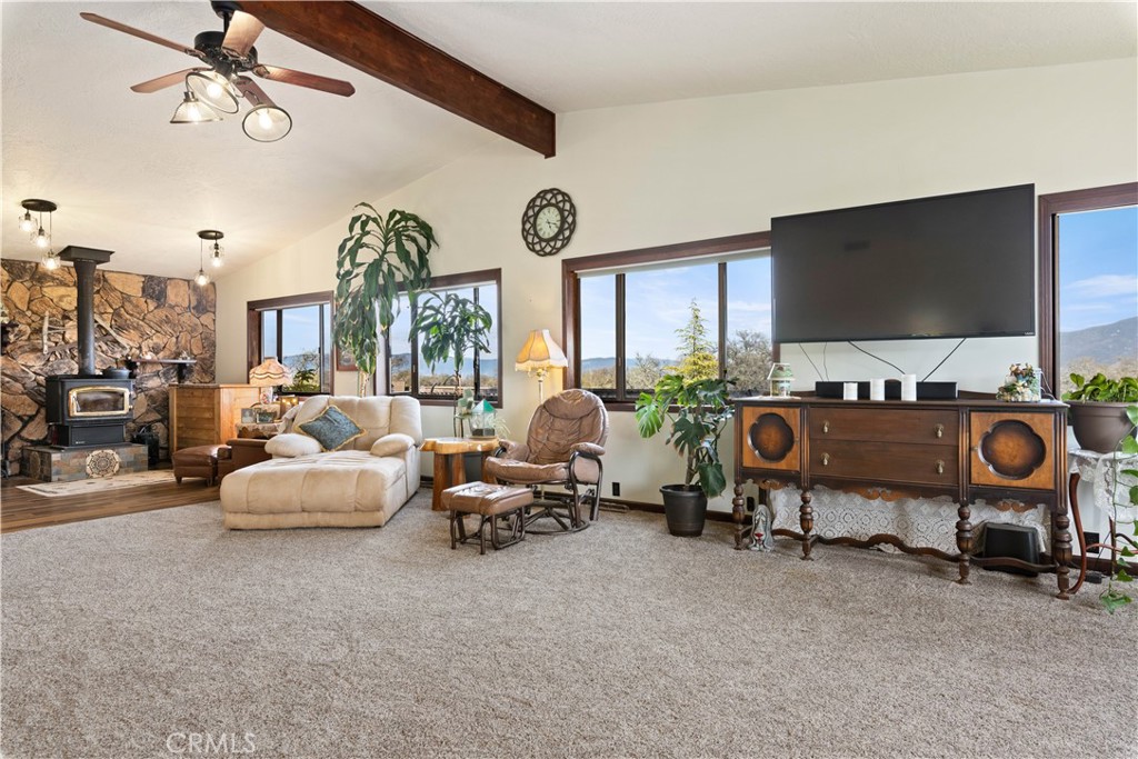 340 Fritch Road Lakeport, CA 95453 - Photo 10 of 65 a living room with furniture gym equipment and a large window