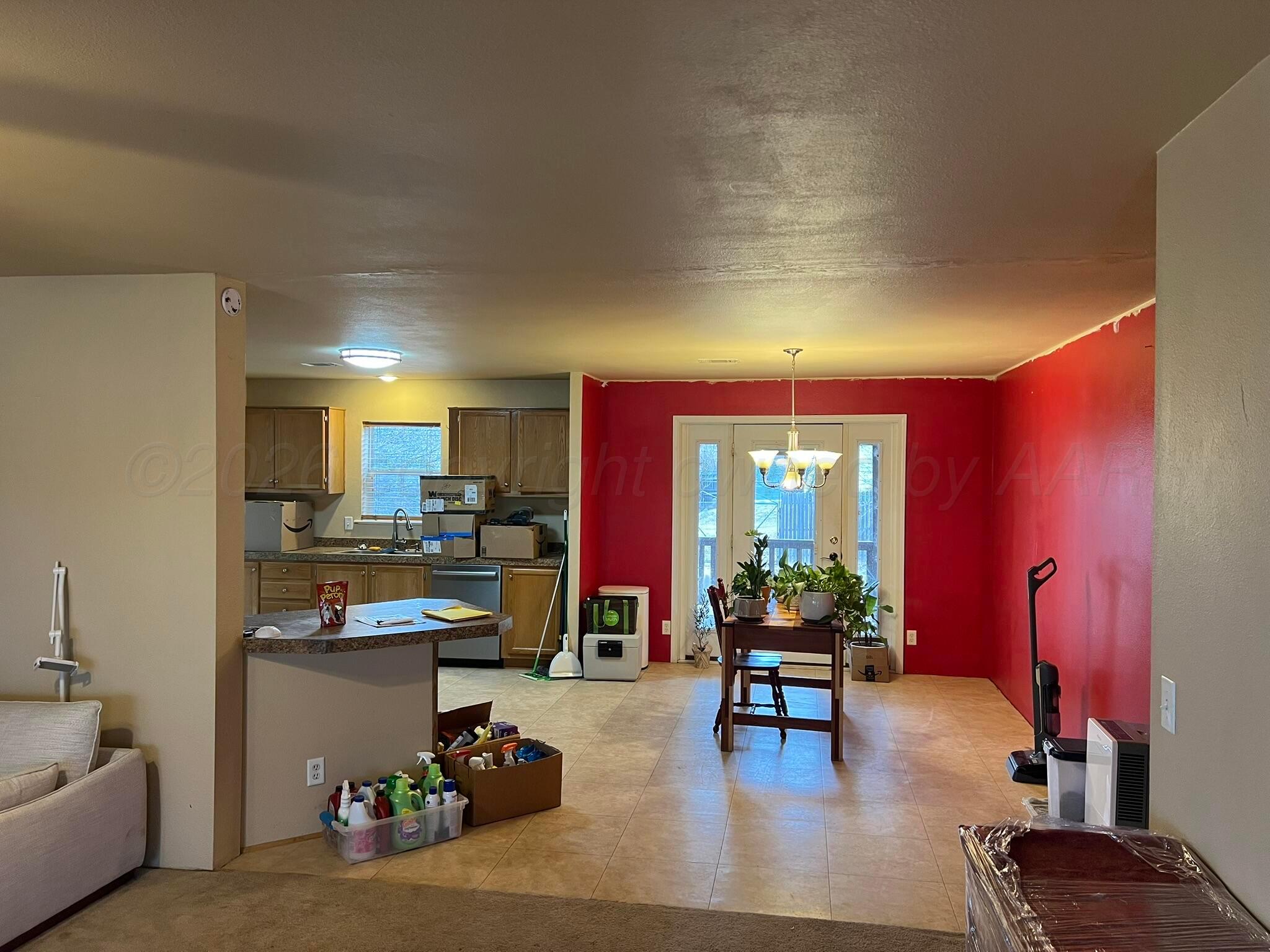707 Conklin Street Canadian, TX 79014 - Photo 12 of 38 a living room with fireplace furniture and a large window