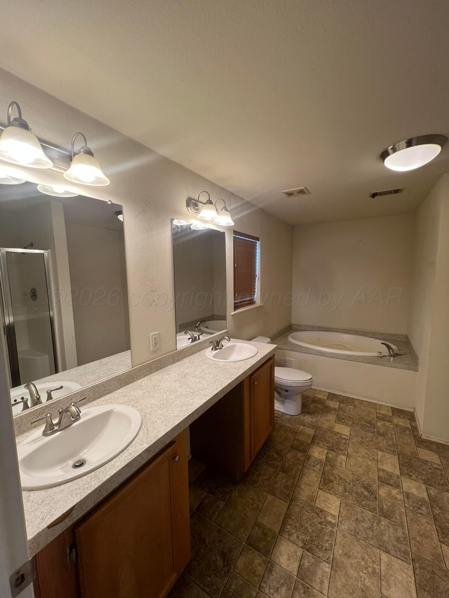 707 Conklin Street Canadian, TX 79014 - Photo 18 of 38 a bathroom with a double vanity sink mirror and toilet