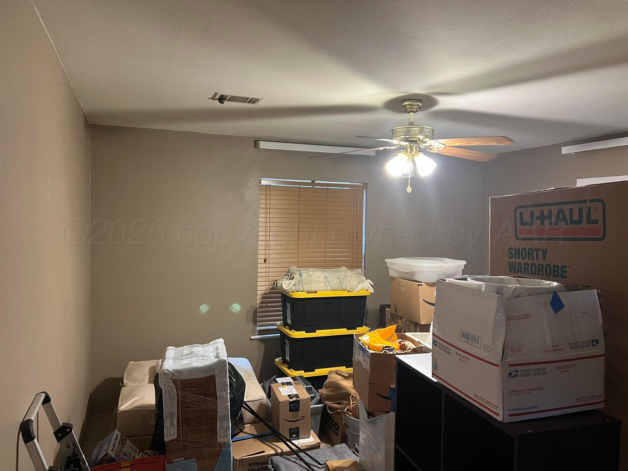 707 Conklin Street Canadian, TX 79014 - Photo 27 of 38 a living room with furniture and paintings on the wall