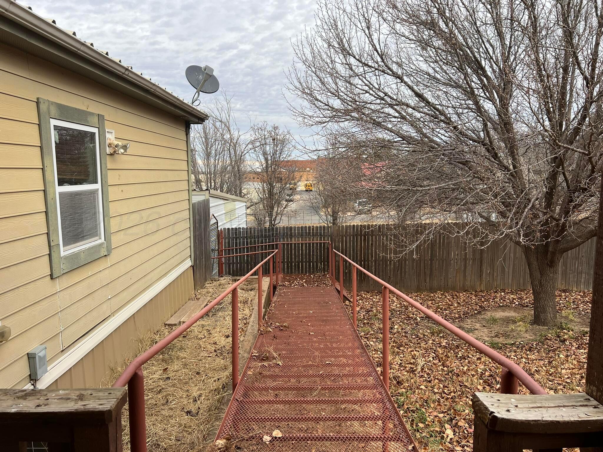 707 Conklin Street Canadian, TX 79014 - Photo 30 of 38 a view of deck with mountain and wooden fence