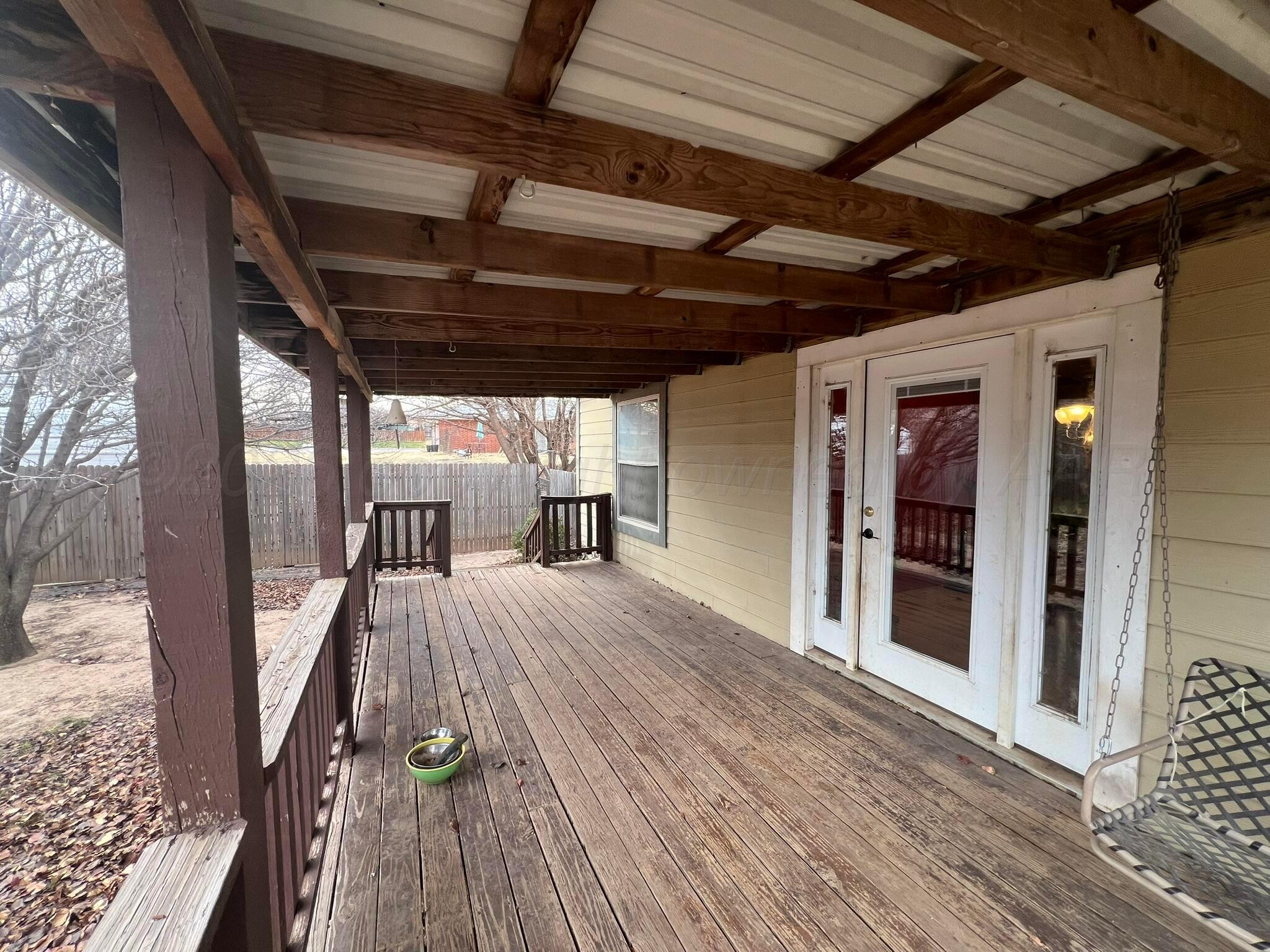 707 Conklin Street Canadian, TX 79014 - Photo 32 of 38 a view of an empty room with wooden floor