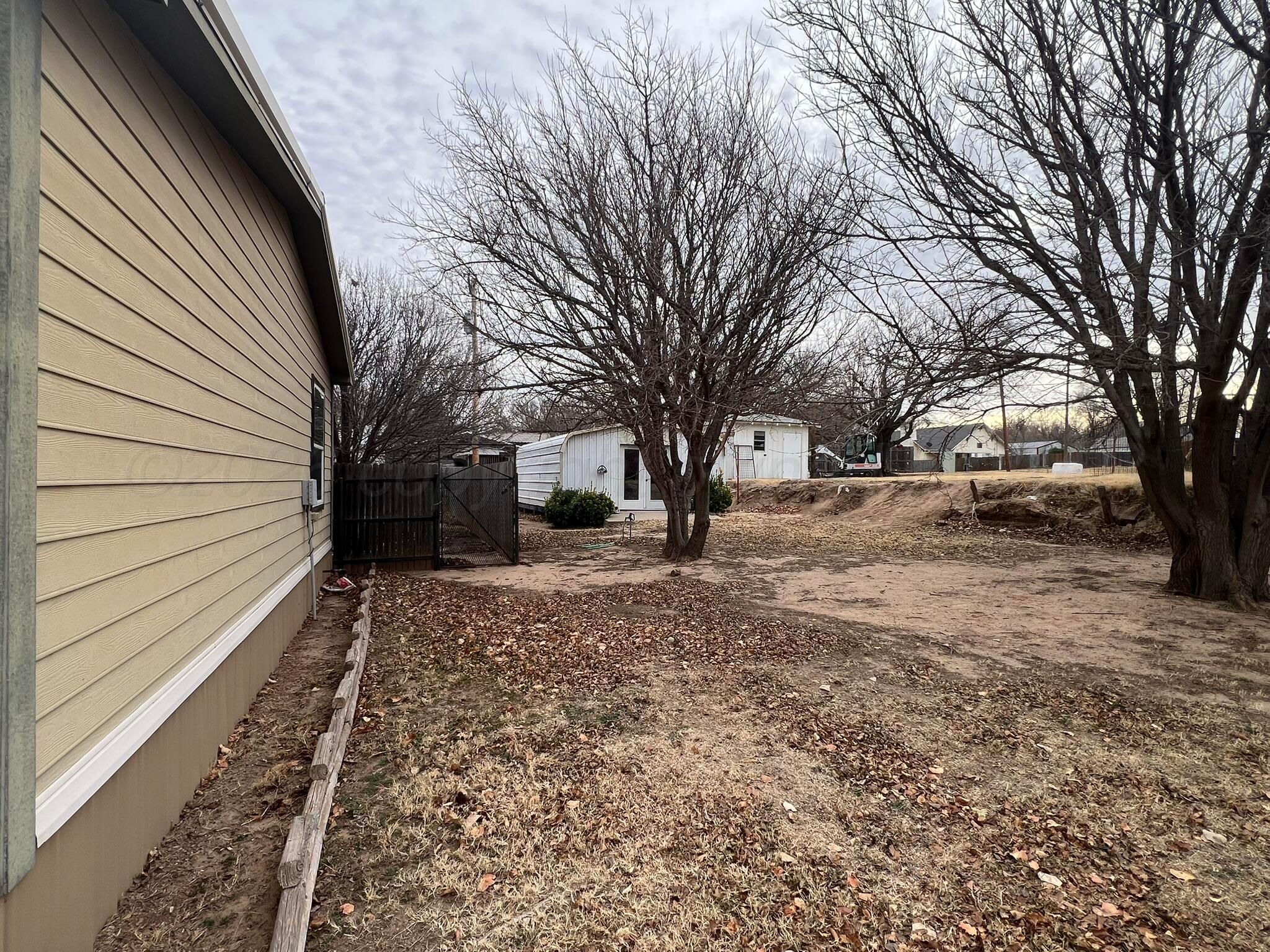707 Conklin Street Canadian, TX 79014 - Photo 35 of 38 a view of a yard covered in snow
