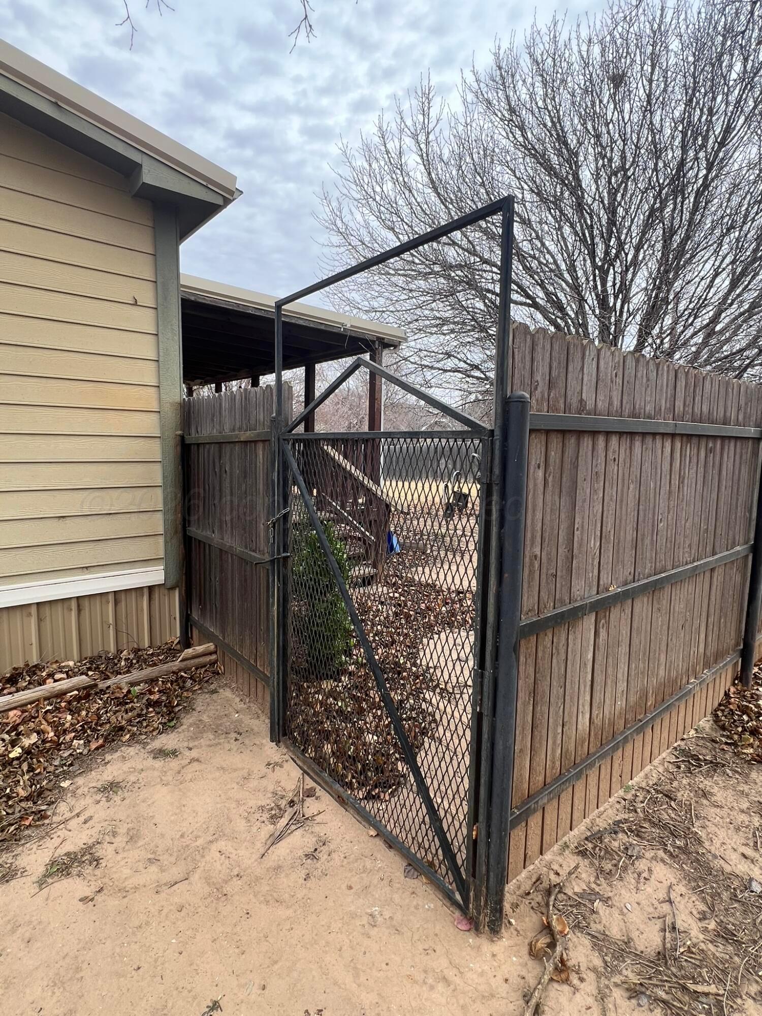 707 Conklin Street Canadian, TX 79014 - Photo 36 of 38 a view of a house with a wooden fence