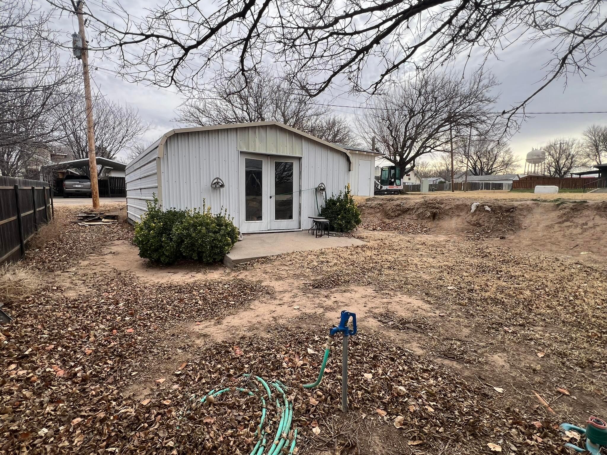 707 Conklin Street Canadian, TX 79014 - Photo 37 of 38 a white house that has a tree in front of it