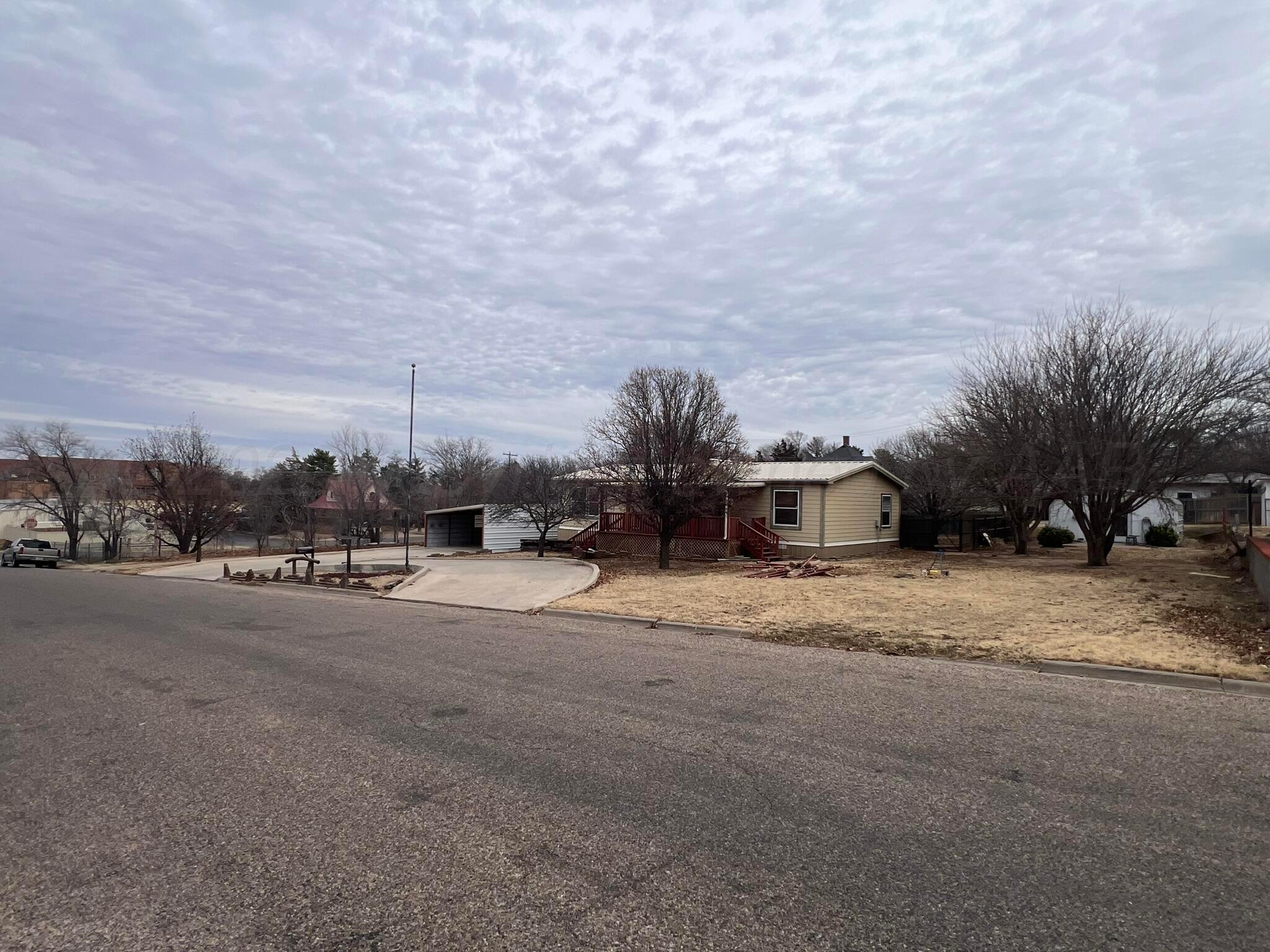707 Conklin Street Canadian, TX 79014 - Photo 4 of 38 a row of houses with outdoor space