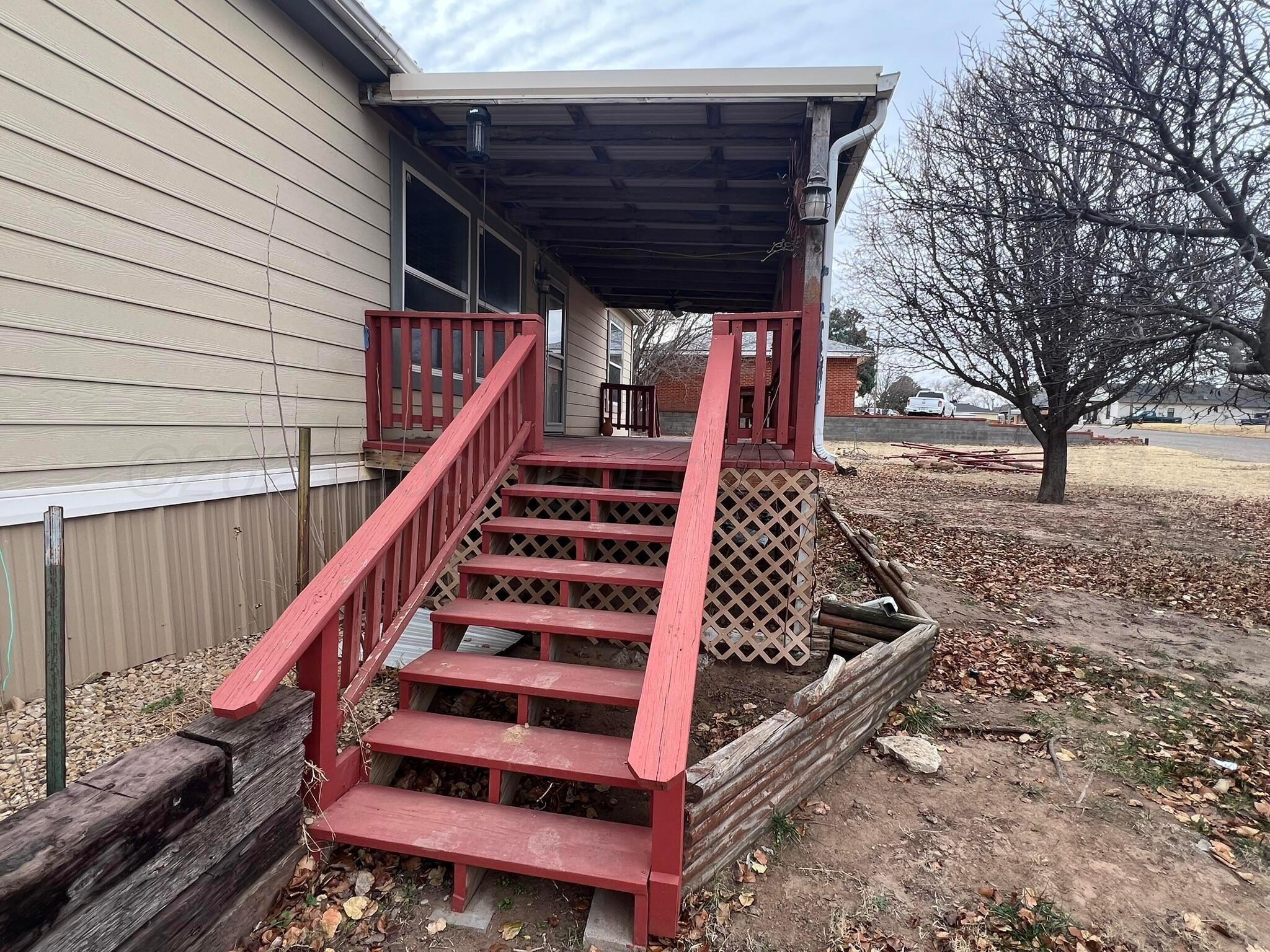 707 Conklin Street Canadian, TX 79014 - Photo 7 of 38 a view of backyard with wooden deck and outdoor seating