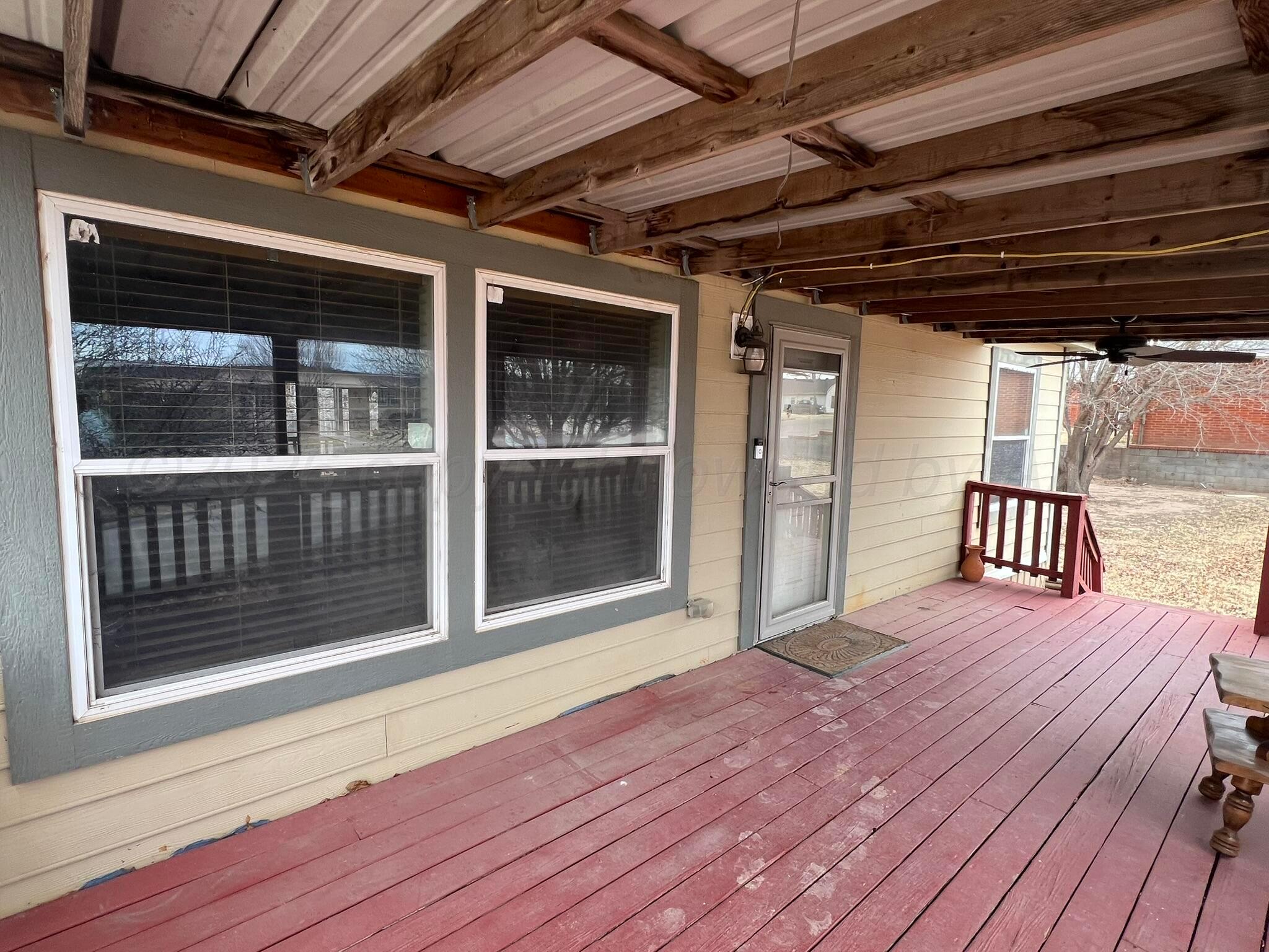 707 Conklin Street Canadian, TX 79014 - Photo 8 of 38 a view of a balcony with wooden floor
