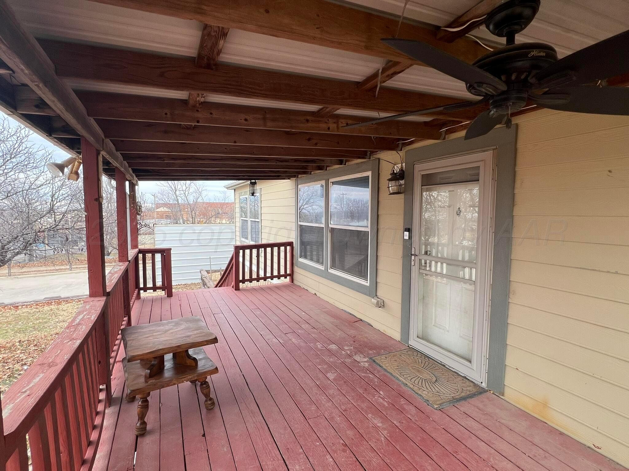 707 Conklin Street Canadian, TX 79014 - Photo 9 of 38 a view of a balcony with wooden floor