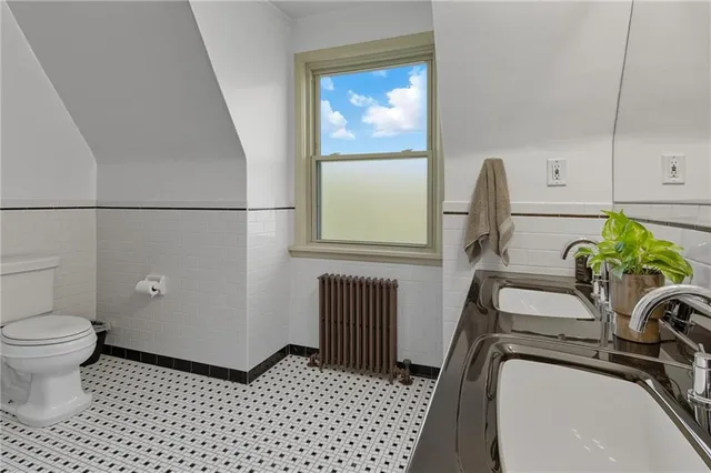 a bedroom with a bed and a fireplace