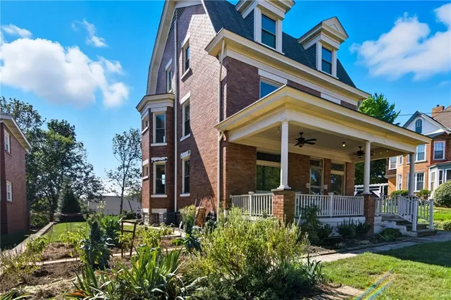 a view of a patio with a table and chairs