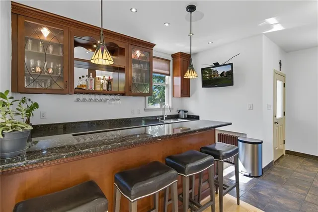 a kitchen with stainless steel appliances granite countertop a sink and a counter space