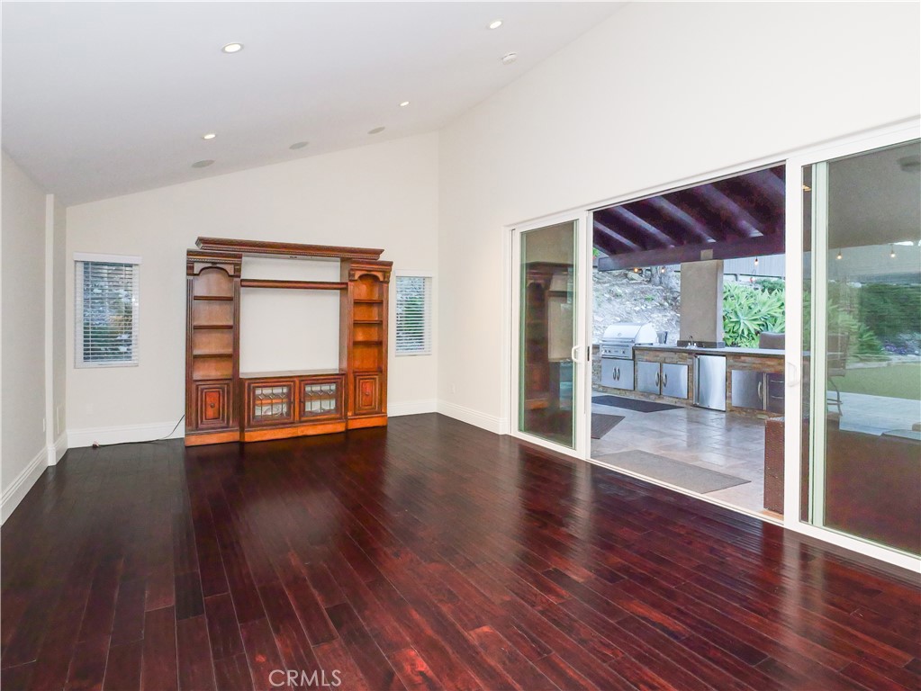 32 Silver Spring Drive Rolling Hills Estates, CA 90274 - Photo 4 of 24 a view of an empty room with wooden floor and a window