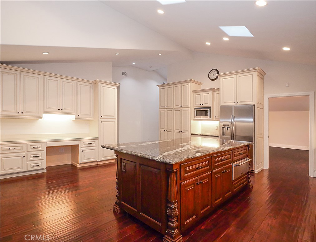 32 Silver Spring Drive Rolling Hills Estates, CA 90274 - Photo 6 of 24 a kitchen with stainless steel appliances granite countertop a stove and a refrigerator