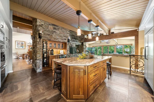 a view of a living room and bathroom with a sink