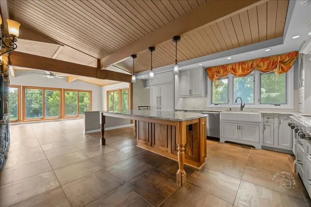 a kitchen with sink cabinets and window
