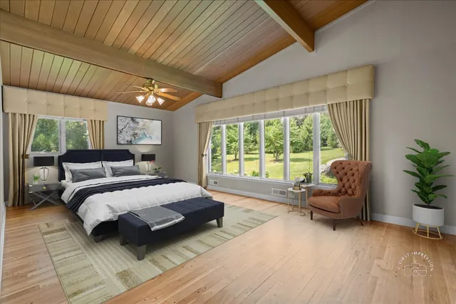 a bedroom with a large bed and a couch