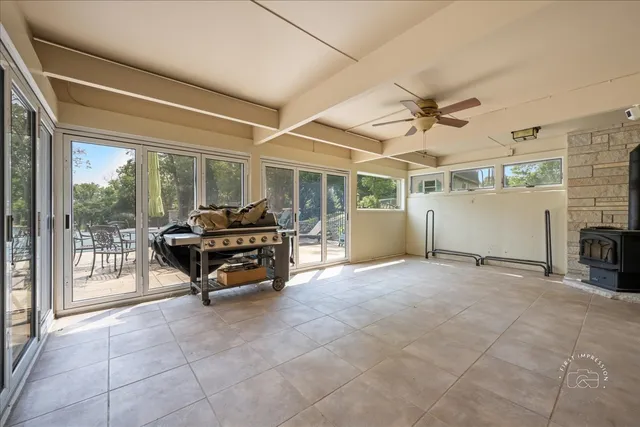 a living room with furniture a fireplace and a table