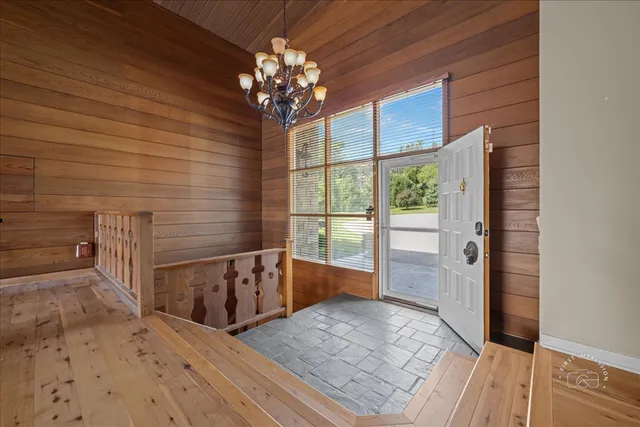 a view of a hallway with a chandelier
