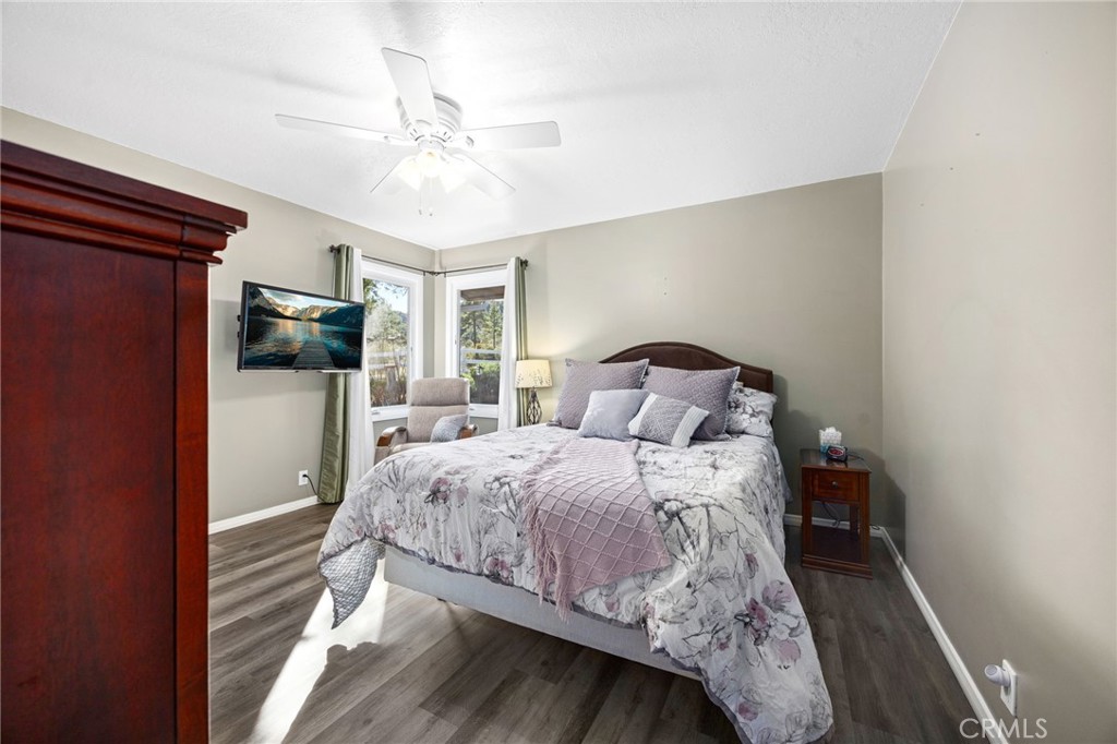 60206 Devils Ladder Road Mountain Center, CA 92561 - Photo 18 of 56 a bedroom with a bed and a chandelier