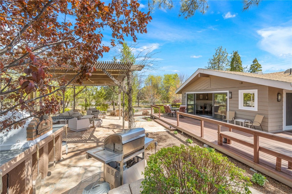 60206 Devils Ladder Road Mountain Center, CA 92561 - Photo 22 of 56 a view of house with outdoor seating