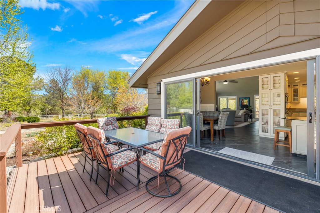 60206 Devils Ladder Road Mountain Center, CA 92561 - Photo 24 of 56 a dining room with furniture and wooden floor