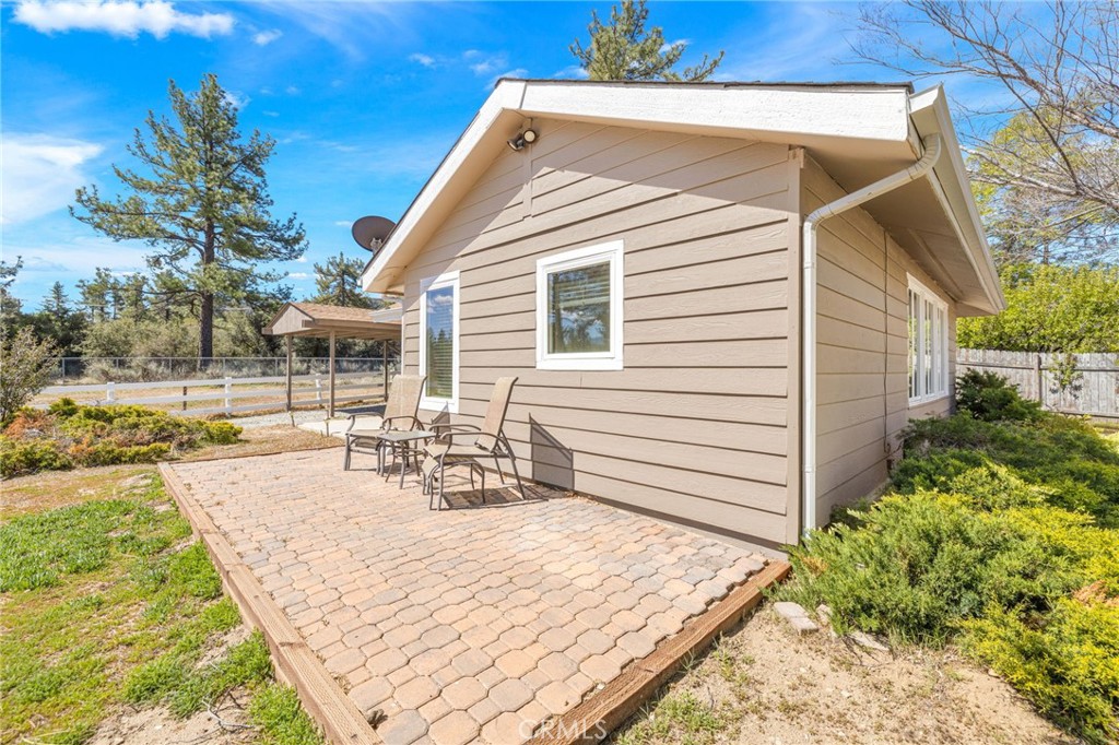 60206 Devils Ladder Road Mountain Center, CA 92561 - Photo 28 of 56 a view of a house with backyard and sitting area
