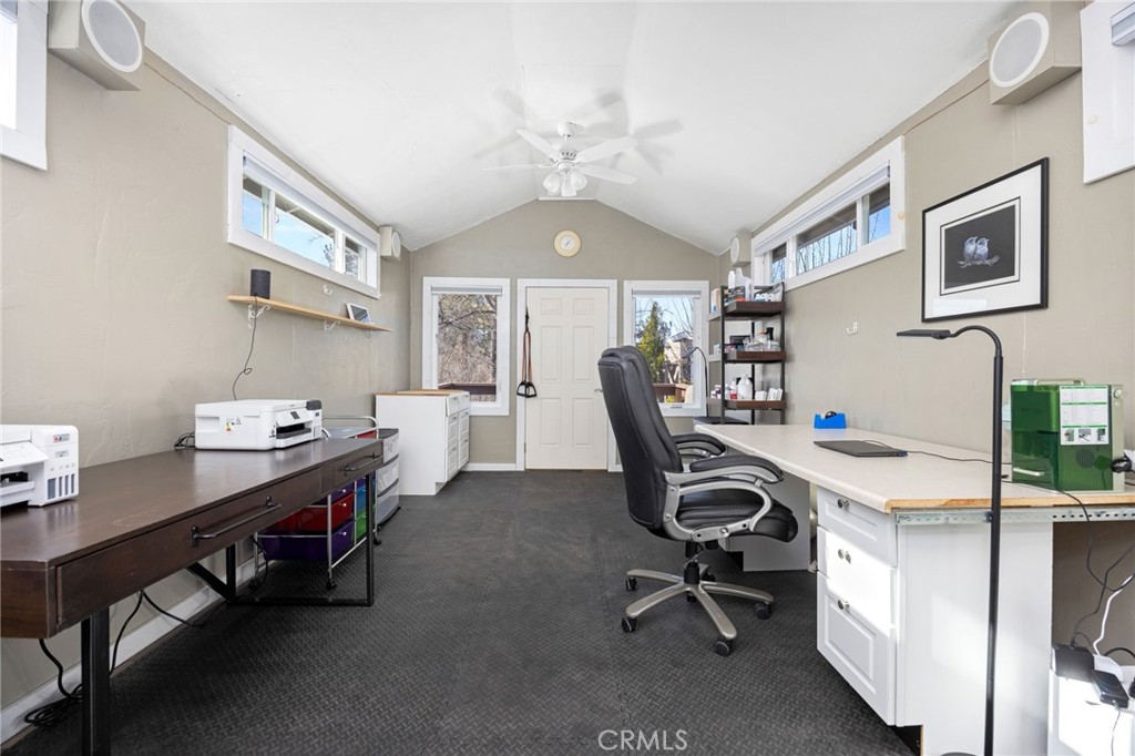 60206 Devils Ladder Road Mountain Center, CA 92561 - Photo 37 of 56 a view of a workspace with furniture and a window
