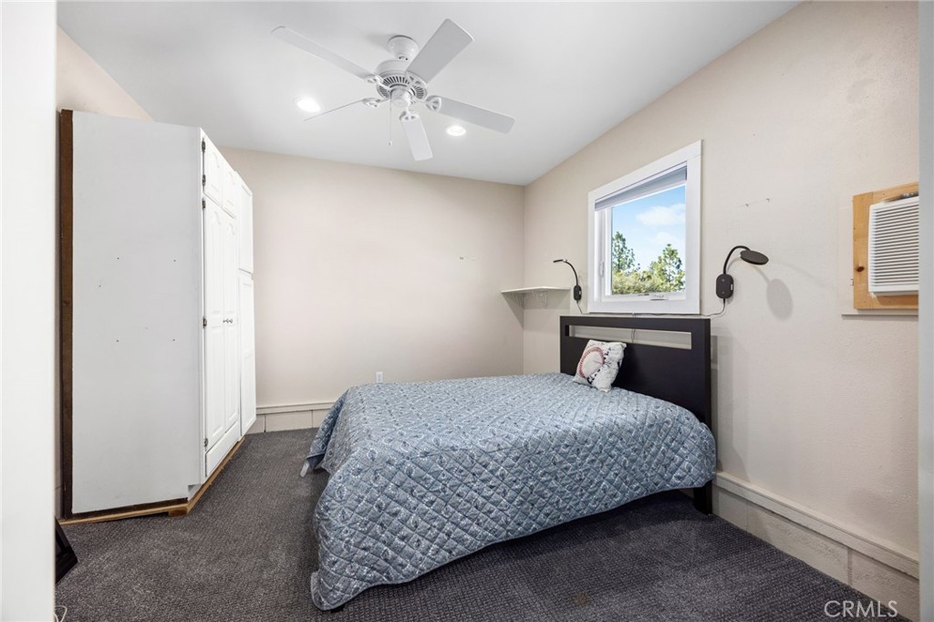 60206 Devils Ladder Road Mountain Center, CA 92561 - Photo 48 of 56 a bedroom with a bed and a window