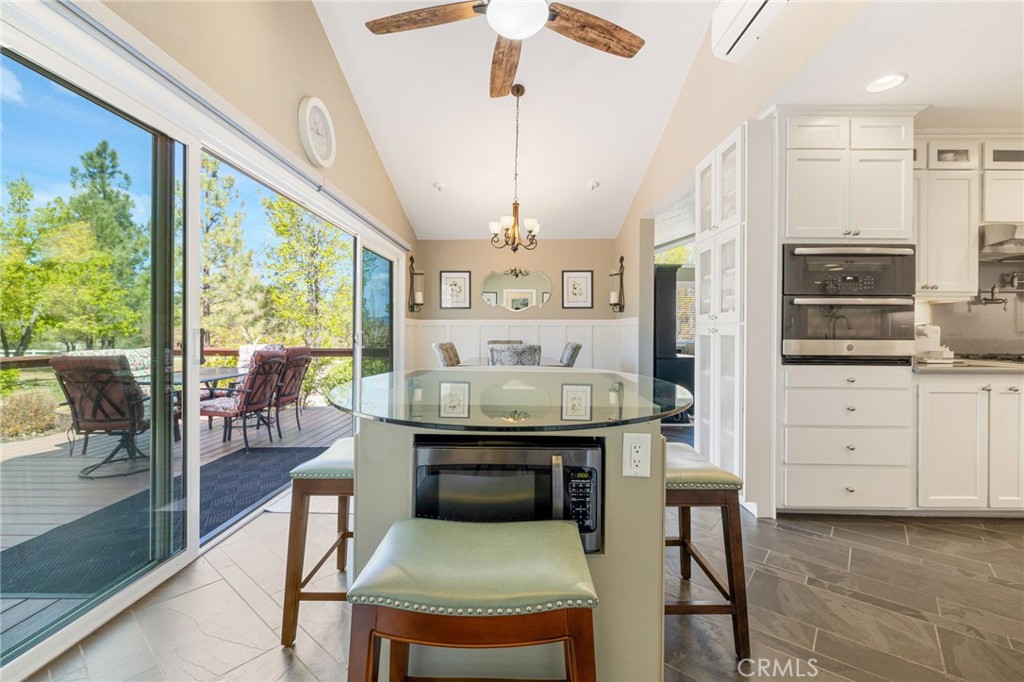 60206 Devils Ladder Road Mountain Center, CA 92561 - Photo 10 of 56 a view of a kitchen with kitchen island granite countertop lots of counter top space