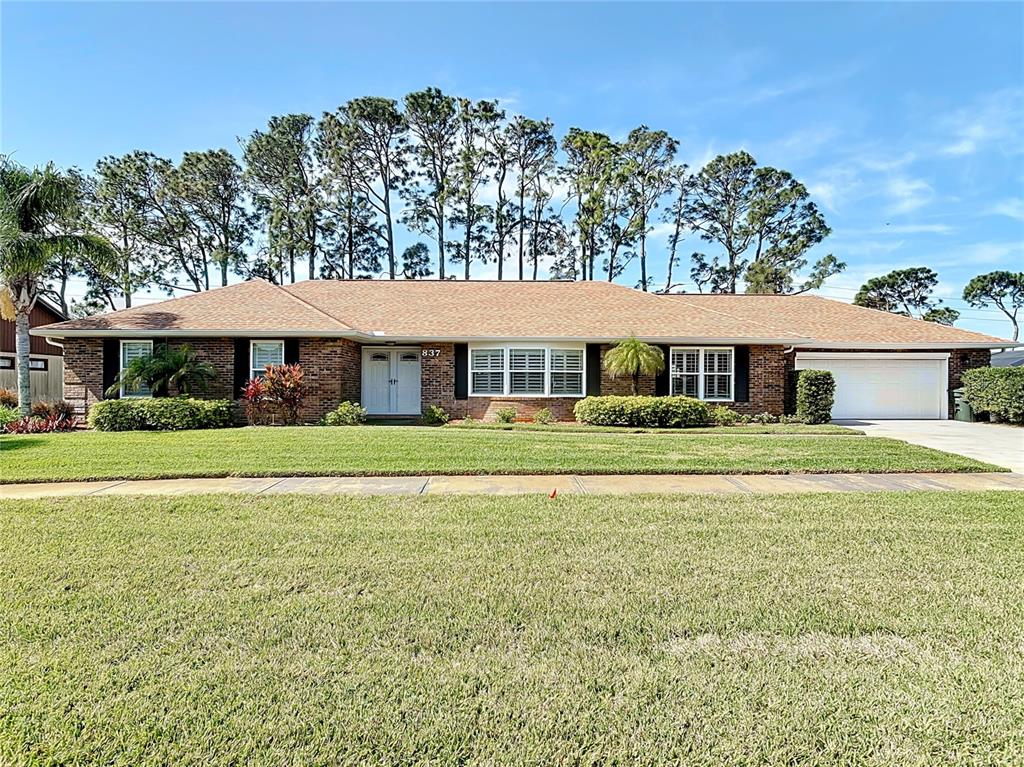 Undisclosed Address Daytona Beach, FL 32119 - Photo 1 of 1 a front view of a house with a yard