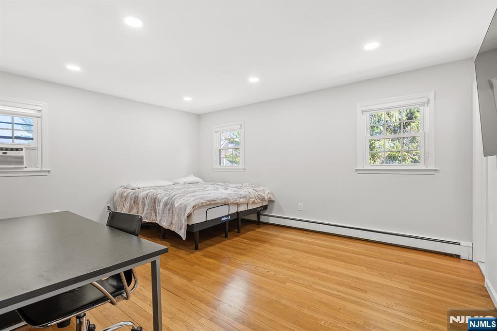 82 Van Horn Street Demarest, NJ 07627 - Photo 18 of 31 a bedroom with a bed and a table in it