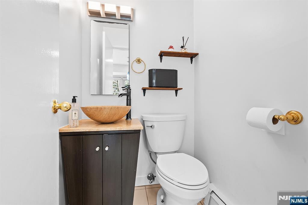 82 Van Horn Street Demarest, NJ 07627 - Photo 19 of 31 a bathroom with a toilet a sink and mirror