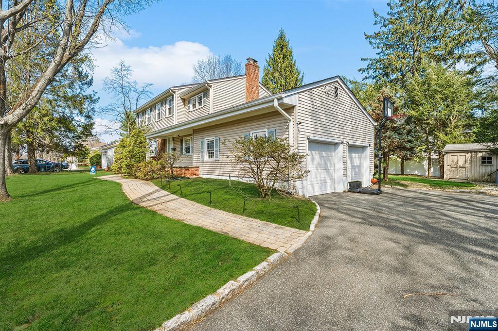 82 Van Horn Street Demarest, NJ 07627 - Photo 2 of 31 a front view of a house with a yard