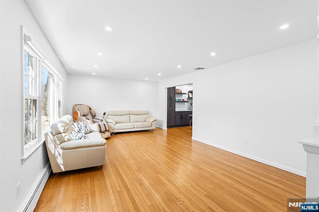 82 Van Horn Street Demarest, NJ 07627 - Photo 5 of 31 a living room with furniture and a wooden floor