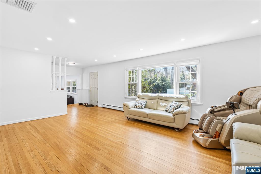 82 Van Horn Street Demarest, NJ 07627 - Photo 6 of 31 a living room with furniture and a large window