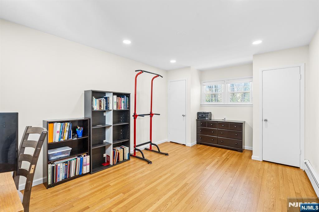 82 Van Horn Street Demarest, NJ 07627 - Photo 10 of 31 a room with lots of furniture and a book shelf