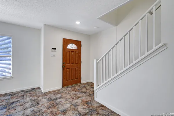 a view of an entryway with stairs