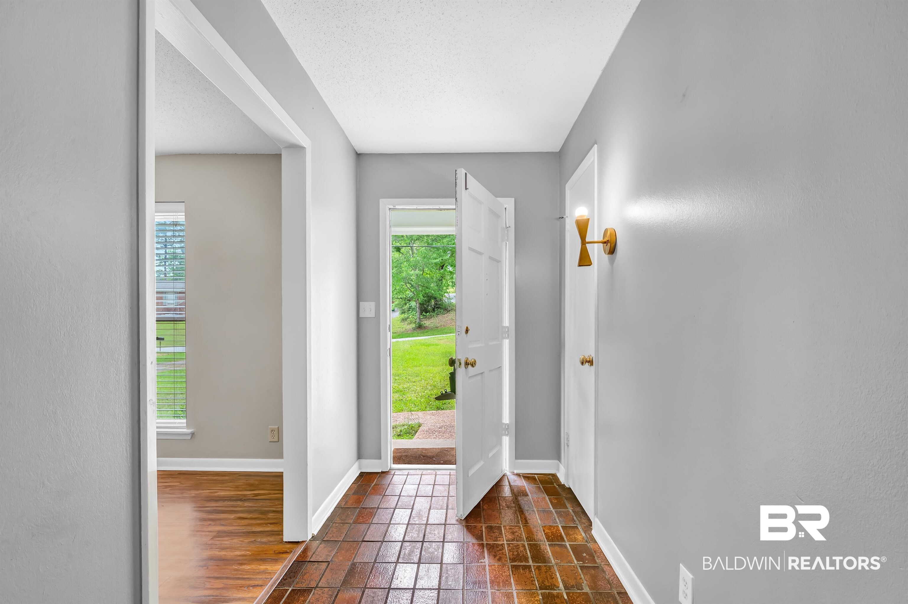 28 Caisson Trace Spanish Fort, AL 36527 - Photo 4 of 51 Entrance foyer with baseboards and stone tile flooring