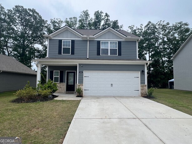 213 Limestone Circle Conyers, GA 30013 - Photo 1 of 1 a front view of a house with a garden
