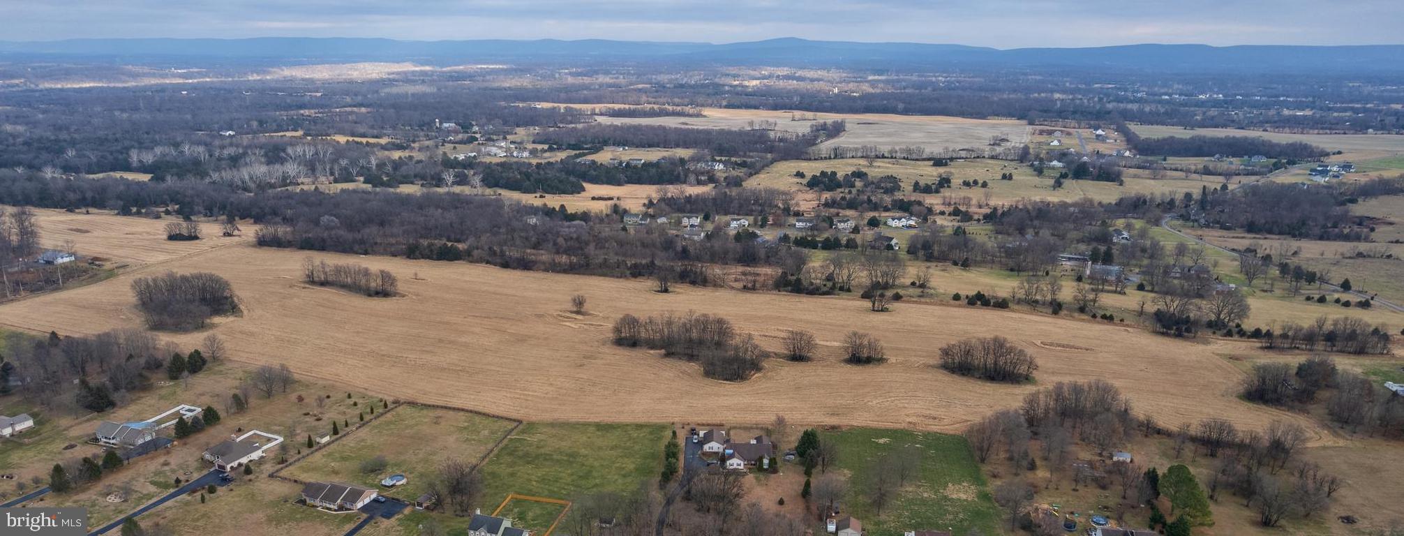 56.37 Swan Pond Road Martinsburg, WV 25404 - Photo 14 of 16 a view of a yard with a mountain