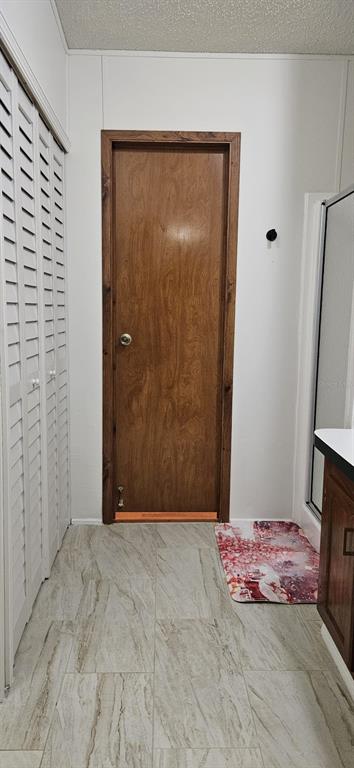 3636 South Lazy Lake Drive Lakeland, FL 33801 - Photo 18 of 28 a view of a room with a wooden door