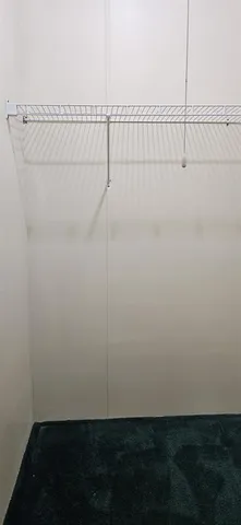 a view of a room with racks on the wall