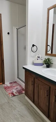 a bathroom with a sink and a mirror